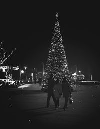 View of illuminated people at night