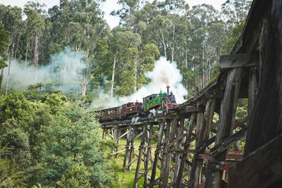 Steam train on wooden bridge