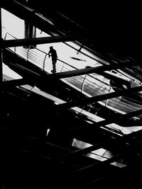 Low angle view of woman walking on staircase