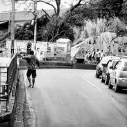 Woman walking on road