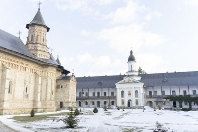 View of buildings against sky during winter