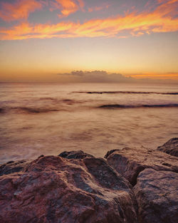 Scenic view of sea against sky during sunset