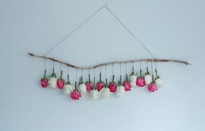 Low angle view of decoration hanging over white background