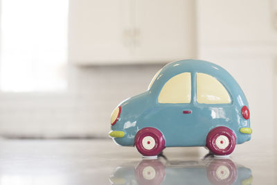 Close-up of toy car on tiled floor at home
