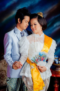 Loving young couple wearing traditional clothing