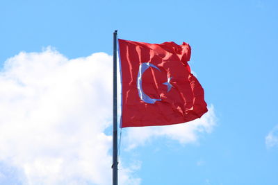 Low angle view of turkish flag against sky