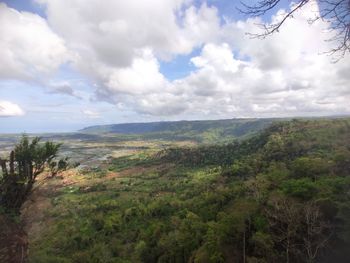 Scenic view of landscape and mountains against sky