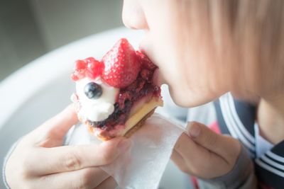 Close-up of hand holding ice cream cone