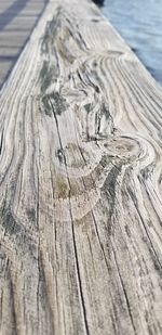 Close-up of wooden plank on table