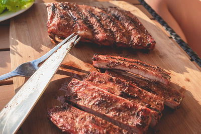 High angle view of meat on barbecue grill