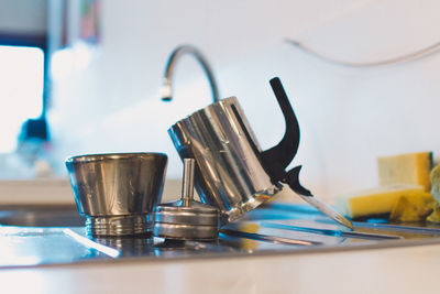 Close-up of glasses on table at home