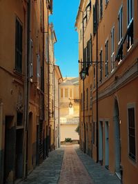 Narrow alley amidst buildings in city