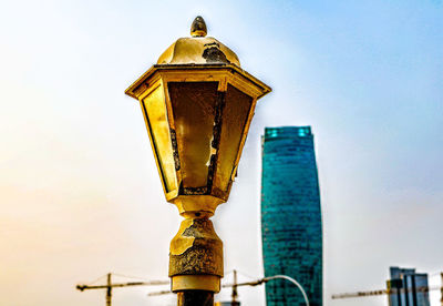 Low angle view of illuminated building against sky