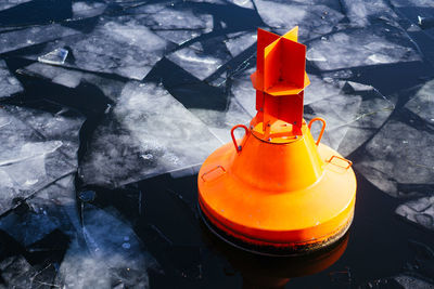 High angle view of orange tea light