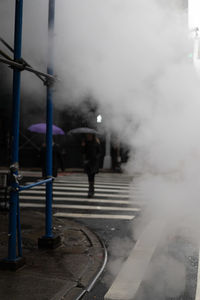 Smoke on street in city