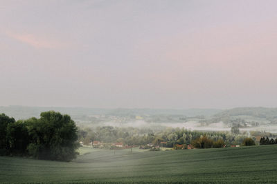 Scenic view of field against clear sky