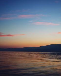 Scenic view of sea against romantic sky at sunset