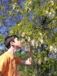Side view of man against plants