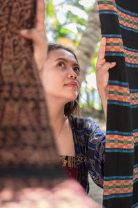 Portrait of young woman looking away