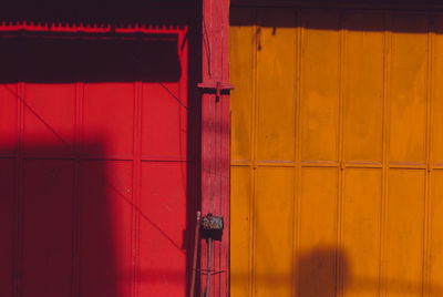High contrast red and orange colors of a closed business shop.
