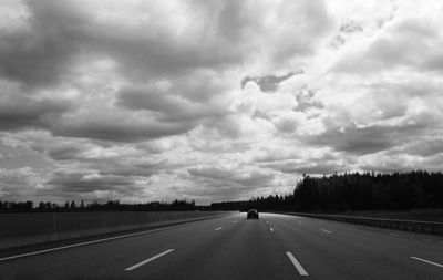 View of road against cloudy sky