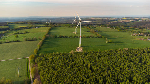 Aerial view of landscape in the eifel region nearby raffelsbrand  with forest and wind wheels