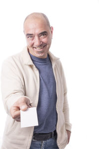 Portrait of a smiling man standing against white background