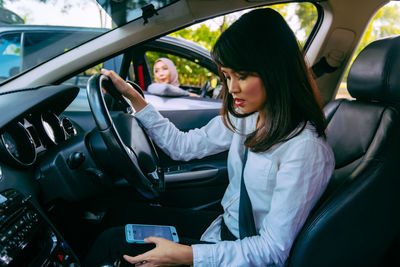 Woman sitting in car