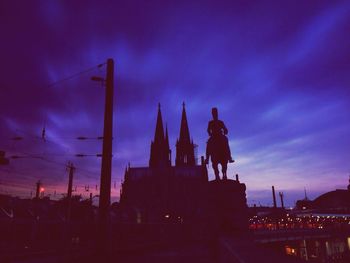 Silhouette of built structure at dusk