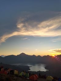 Scenic view of silhouette mountains against sky at sunset