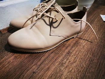 High angle view of shoes on wooden floor