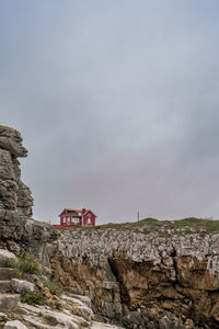 Scenic view of cliff against sky