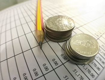 High angle view of coins on table