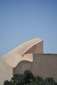 Low angle view of building against blue sky