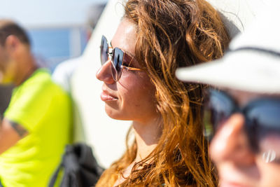 Thoughtful woman wearing sunglasses during sunny day