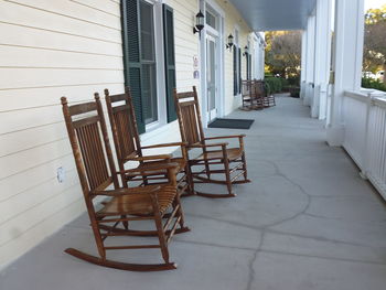 Empty chairs and tables at porch