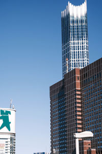 Low angle view of modern buildings against clear sky