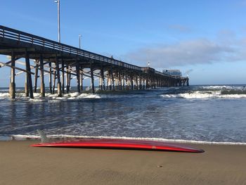 Pier over sea against sky