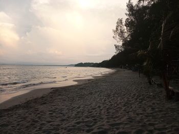 Scenic view of beach against sky during sunset