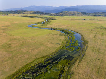 The aerial view of cetina river in the karst plain, croatia