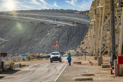 Vehicles on road at construction site