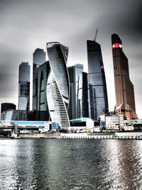 City skyline against cloudy sky