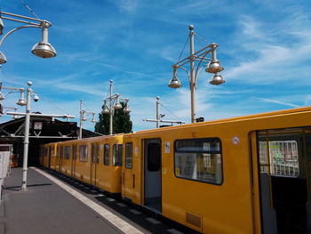 Train at railroad station against sky