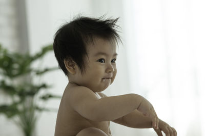 Portrait of cute baby girl at home