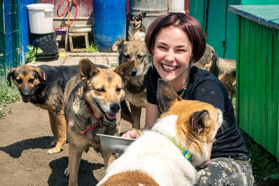 Portrait of woman with dogs