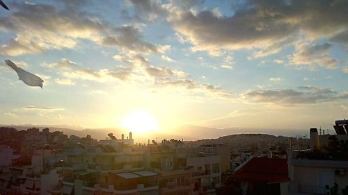 Cityscape against sky during sunset