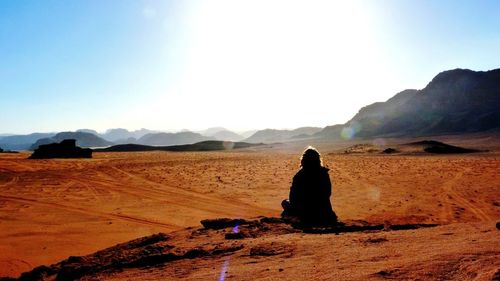 Person sitting on hill