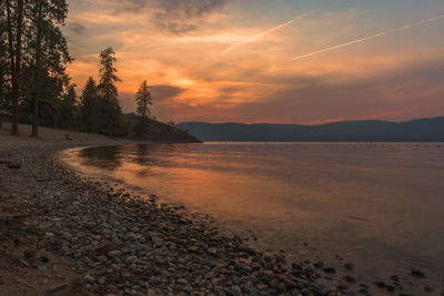 Scenic view of beach against sky during sunset