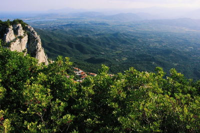 High angle view of green landscape against sky