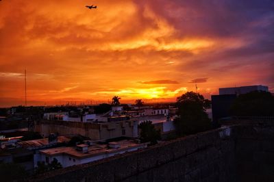 High angle view of buildings against sky during sunset